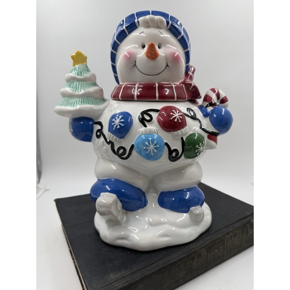 Skating Snowman With A Blue  And  White Hat And A Red And White Scarf Cookie Jar